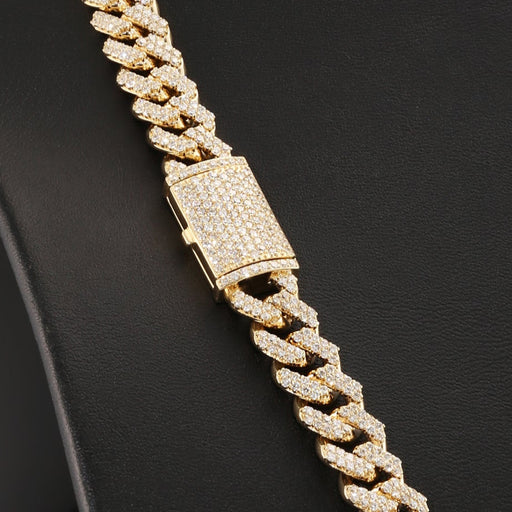 Gold chain necklace on a black mannequin bust.